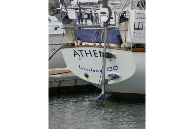 Slide: The Image of Sailboat stern with "ATHENA" name, Cape Dory 36, 1982 model, docked in marina. - 47