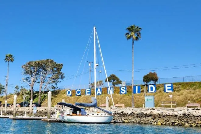 Slide: The Image of Sailboat docked at Oceanside harbor, Cape Dory 36, 1982 model, clear blue sky. - 55