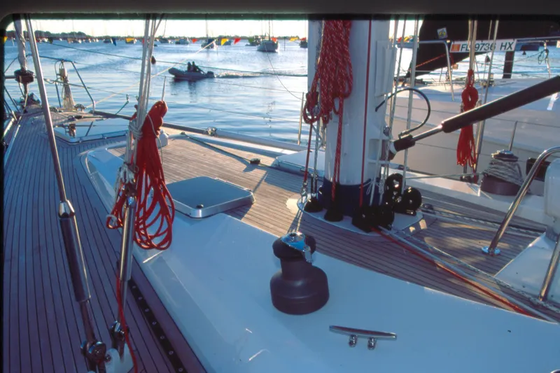 Slide: The Image of Deck view of a 2001 Baltic 52 sailboat with ropes and winches in a marina. - 1