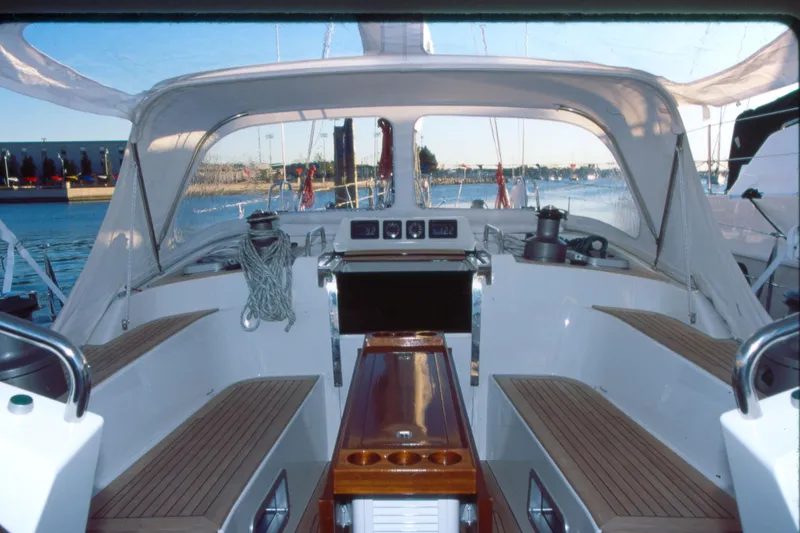 Slide: The Image of Cockpit of a 2001 Baltic 52 sailboat with teak seating and nautical equipment. - 3
