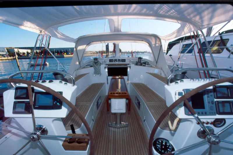 Slide: The Image of Cockpit of a 2001 Baltic 52 yacht with dual steering wheels and navigation instruments. - 4
