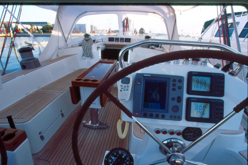 Slide: The Image of Cockpit of a 2001 Baltic 52 yacht with navigation instruments and steering wheel. - 5