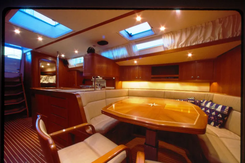 Slide: The Image of Luxurious interior of a 2001 Baltic 52 yacht with elegant wood finishes and skylights. - 9