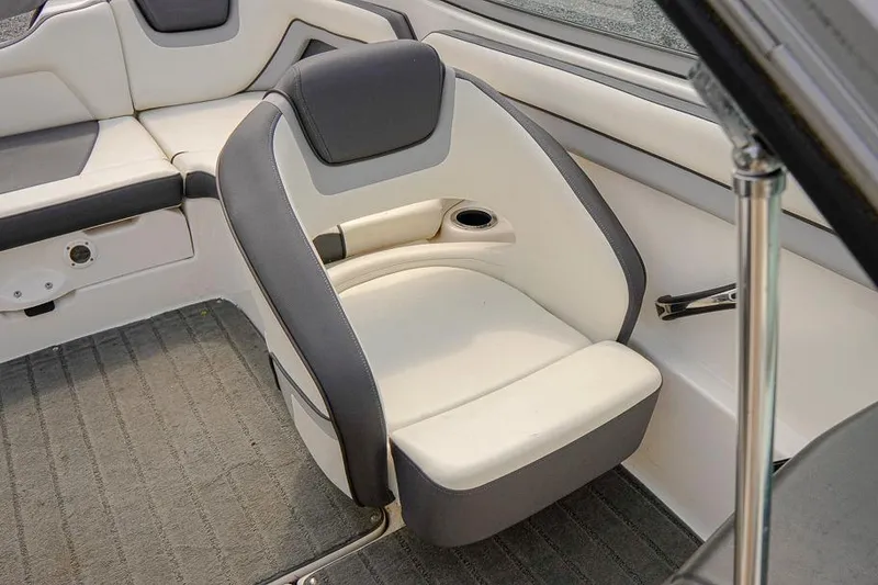 Slide: The Image of 2015 Yamaha Boats SX192 interior seating with cup holder, featuring gray and white upholstery. - 11