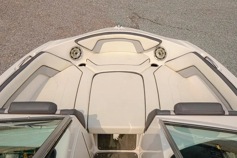 Slide: The Image of 2015 Yamaha Boats SX192 bow seating area with speakers and cushioned seats. - 12