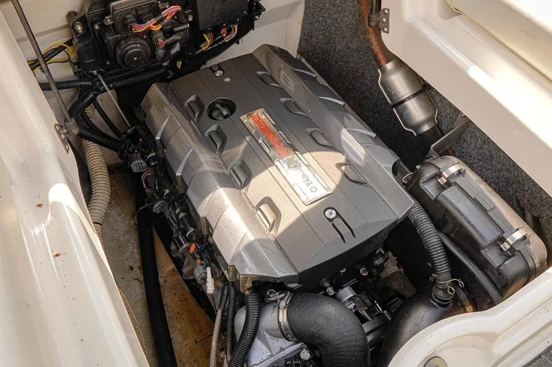 Slide: The Image of Engine compartment of a 2015 Yamaha Boats SX192, showcasing its powerful motor. - 17