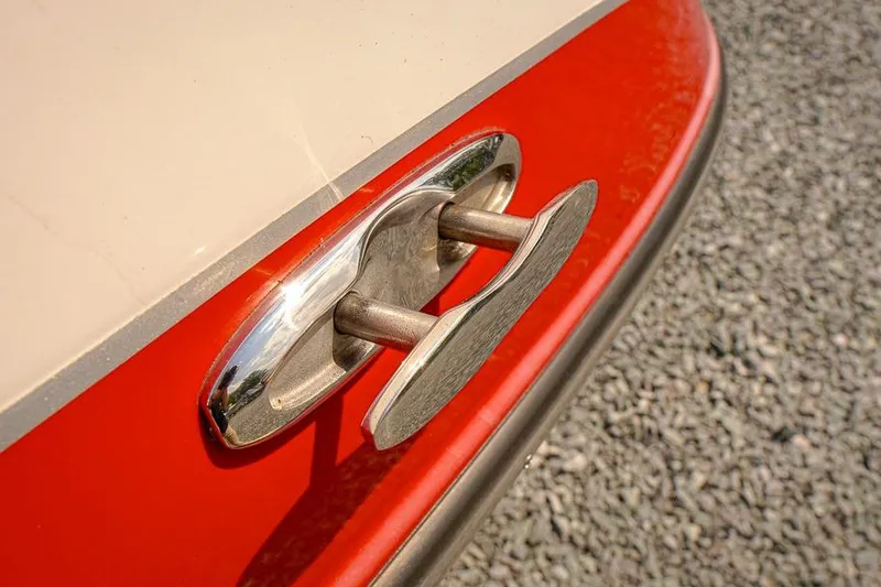 Slide: The Image of Close-up of a 2015 Yamaha SX192 boat cleat on a red and white hull. - 20