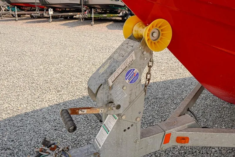 Slide: The Image of Trailer hitch of a 2015 Yamaha Boats SX192 on gravel surface. - 22