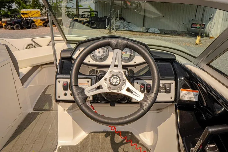 Slide: The Image of 2015 Yamaha Boats SX192 dashboard with steering wheel and control panel. - 7