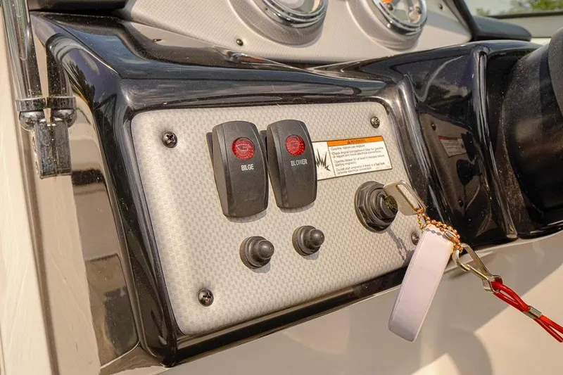 Slide: The Image of Control panel of a 2015 Yamaha Boats SX192, featuring bilge and blower switches. - 9