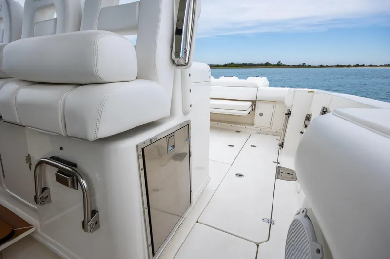 Slide: The Image of 2017 Boston Whaler 370 Outrage interior with white seating and ocean view. - 39