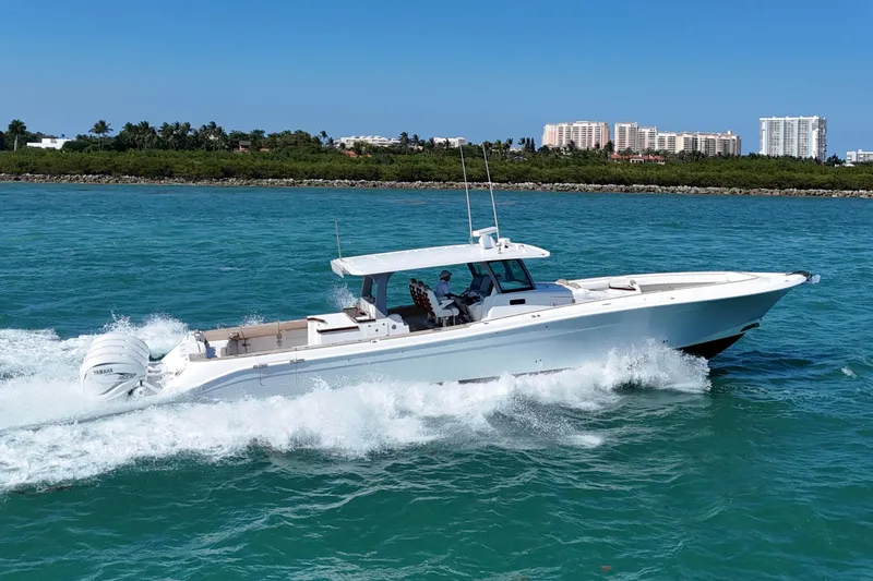 Slide: The Image of 2019 HCB 53 Suenos boat cruising on blue ocean near coastline. - 10