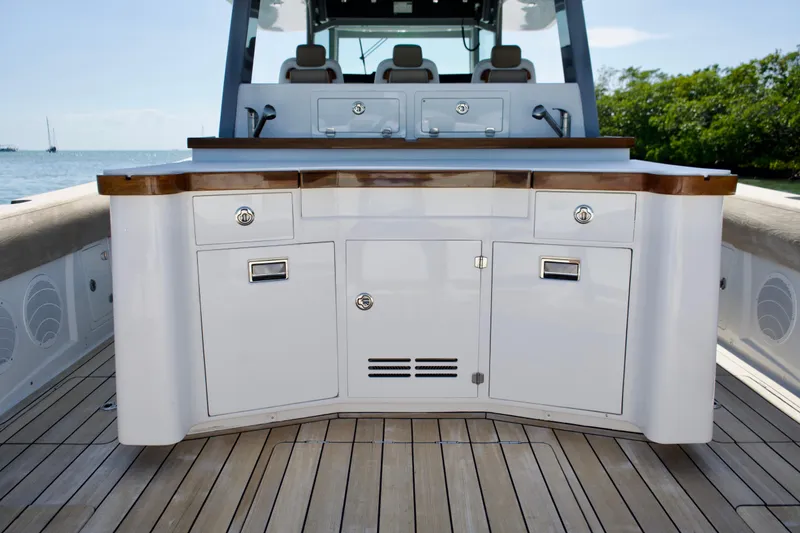 Slide: The Image of 2019 HCB 53 Suenos boat deck with sleek cabinetry and ocean view. - 16