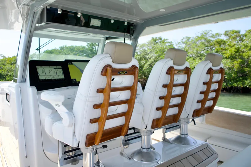 Slide: The Image of 2019 HCB 53 Suenos boat interior with luxurious seating and advanced navigation system. - 20