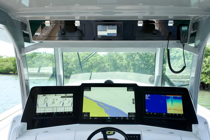 Slide: The Image of 2019 HCB 53 Suenos boat dashboard with advanced navigation and control systems. - 22