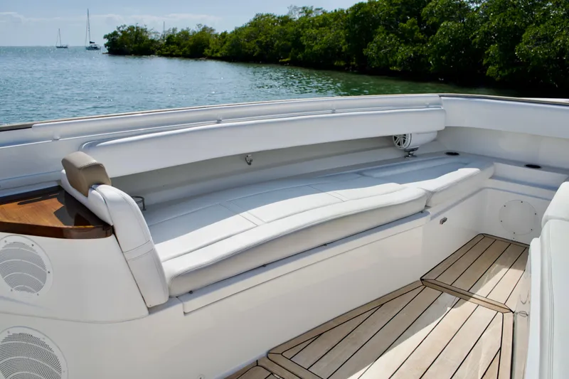 Slide: The Image of Luxurious seating area on 2019 HCB 53 Suenos boat with scenic water view. - 25