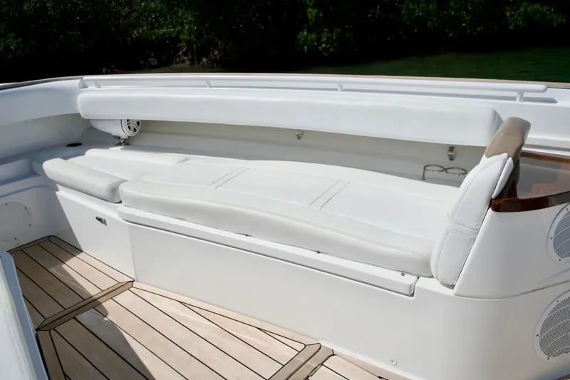 Slide: The Image of Luxurious seating on 2019 HCB 53 Suenos boat with sleek white upholstery and wooden deck. - 26
