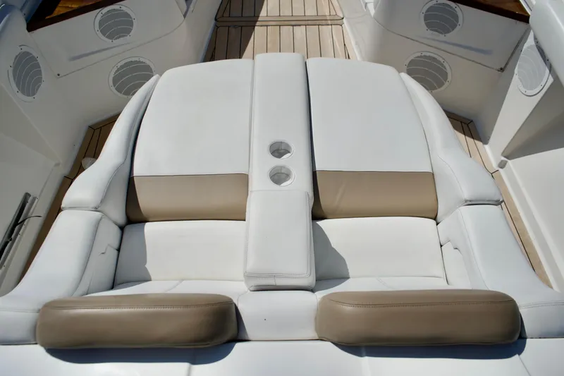 Slide: The Image of Luxurious seating on 2019 HCB 53 Suenos boat with cup holders and beige accents. - 27