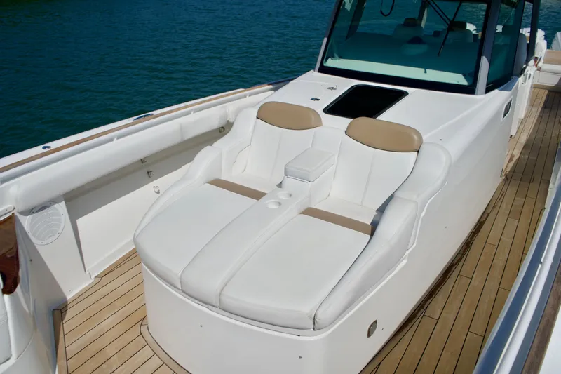 Slide: The Image of Luxurious seating on 2019 HCB 53 Suenos boat with teak deck and elegant design. - 29