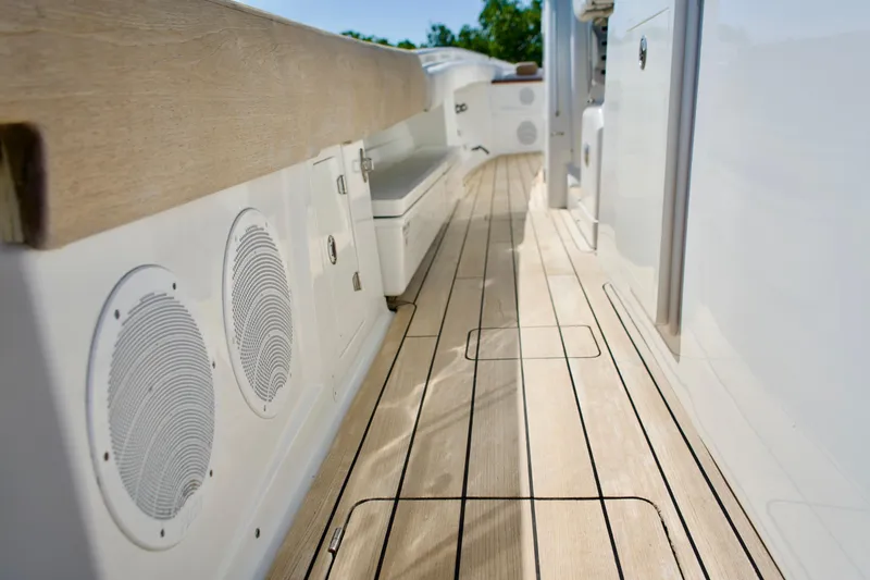 Slide: The Image of 2019 HCB 53 Suenos boat deck with wood finish and built-in speakers. - 32