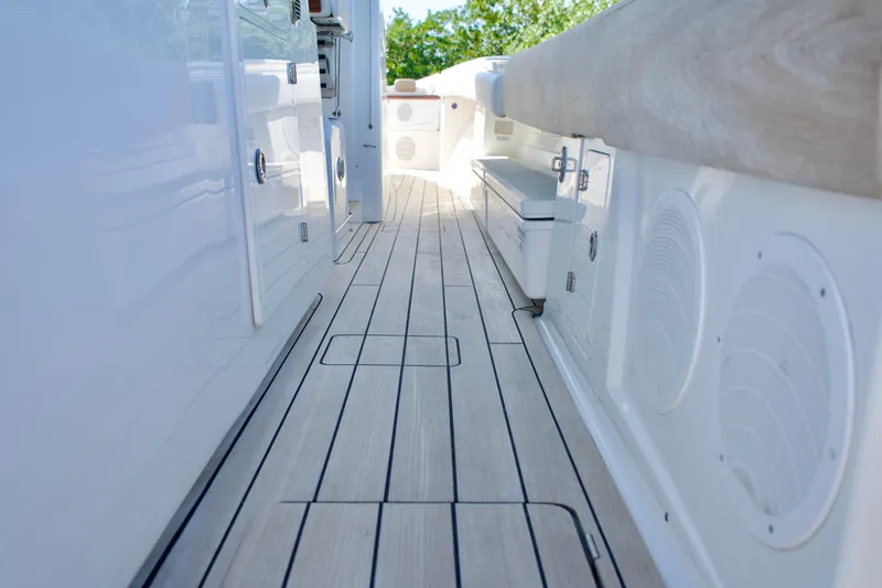 Slide: The Image of 2019 HCB 53 Suenos boat deck with sleek wood finish and modern design. - 33