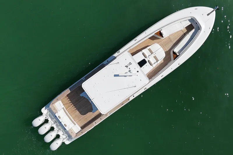 Slide: The Image of Aerial view of 2019 HCB 53 Suenos luxury boat on green water. - 9
