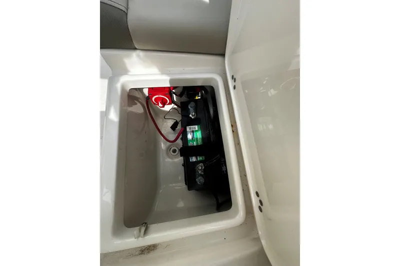 Slide: The Image of Battery compartment of 2022 Key West 203 DFS boat, featuring wiring and connections. - 9