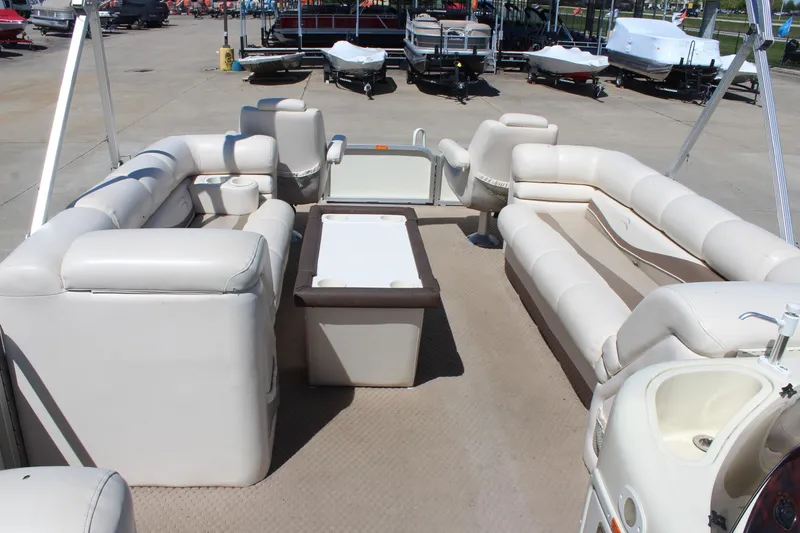 Slide: The Image of Interior of a 2002 Bennington 2575FS pontoon boat with spacious seating and table. - 24