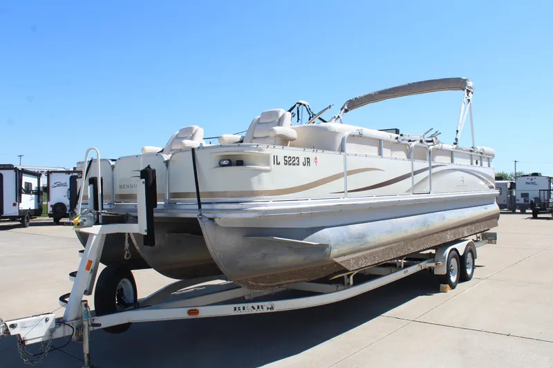 Slide: The Image of 2002 Bennington 2575FS pontoon boat on trailer in parking lot. - 3