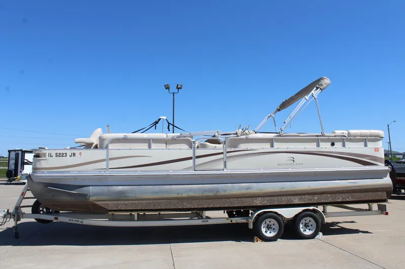 Slide: The Image of 2002 Bennington 2575FS pontoon boat on trailer under clear blue sky. - 4