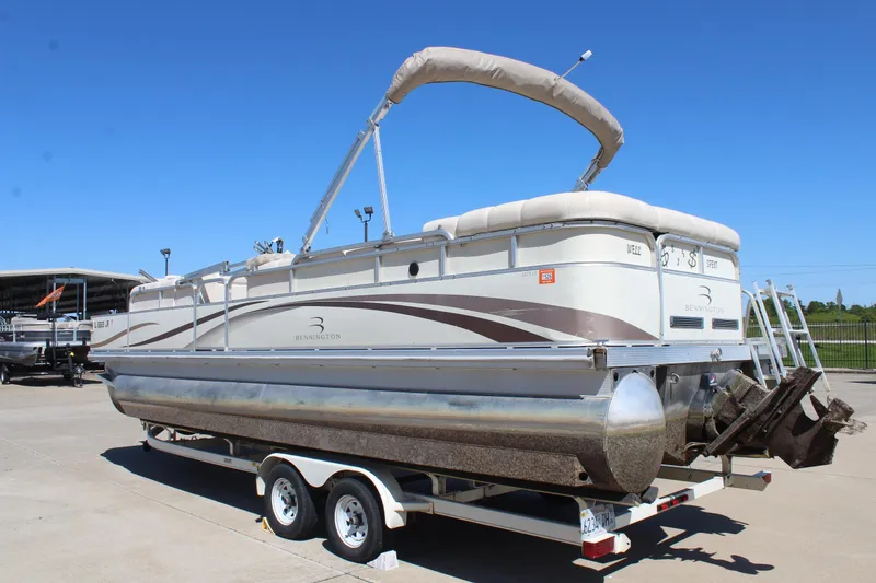 Slide: The Image of 2002 Bennington 2575FS pontoon boat on trailer under clear blue sky. - 5