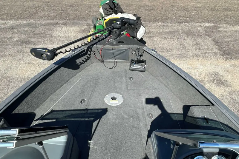 Slide: The Image of 2013 Lund 1775 Impact XS boat deck with trolling motor and storage compartments. - 4