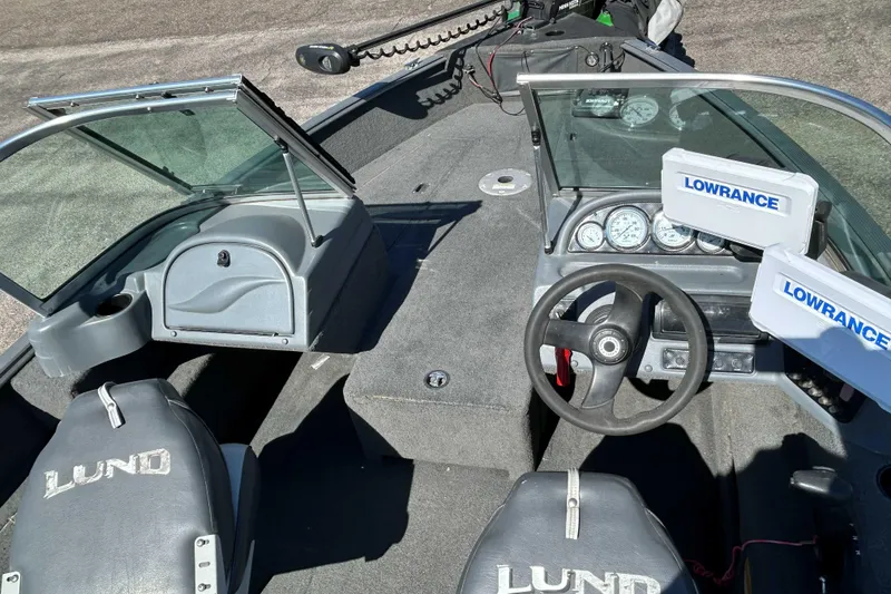 Slide: The Image of 2013 Lund 1775 Impact XS boat interior with Lowrance electronics and dual consoles. - 6