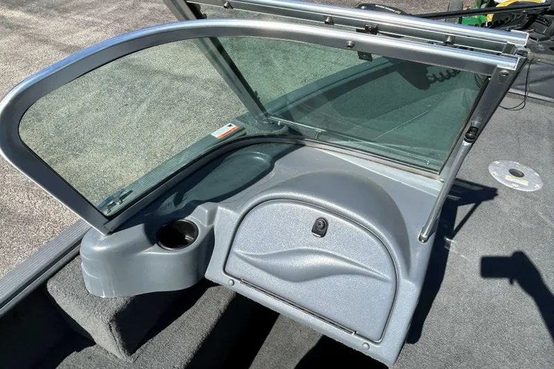 Slide: The Image of 2013 Lund 1775 Impact XS boat windshield and console with cup holder. - 7