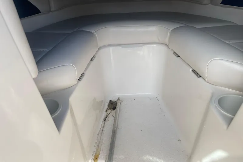 Slide: The Image of Interior of 1999 Chaparral 1830 SS boat with white seating and cup holders. - 10