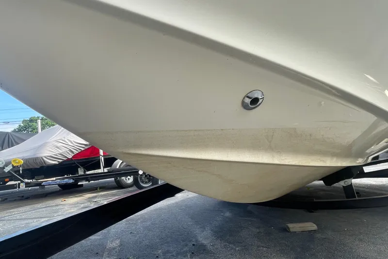 Slide: The Image of 1999 Chaparral 1830 SS boat hull on trailer, showing underside and drain plug. - 7