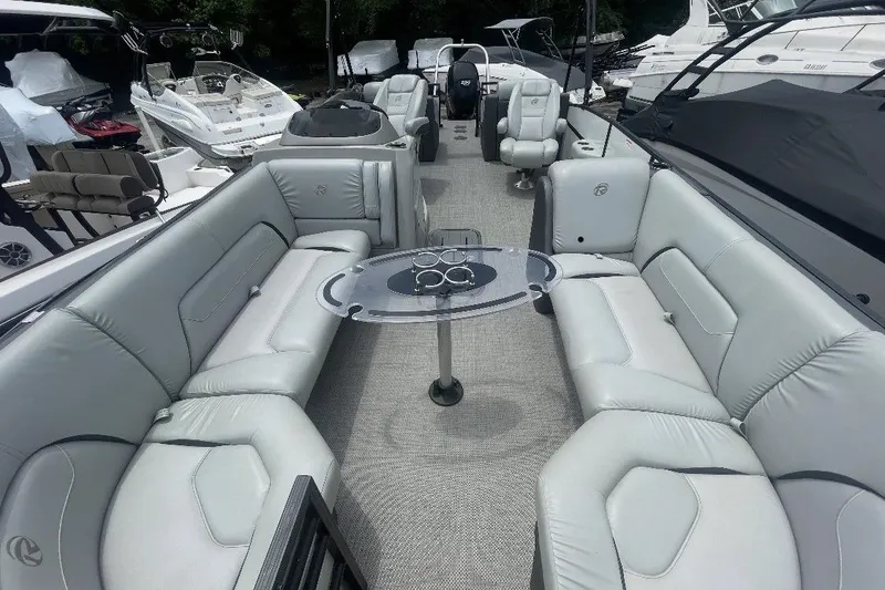 Slide: The Image of 2018 Lowe Retreat 250 RFL pontoon boat with spacious seating and modern design. - 4