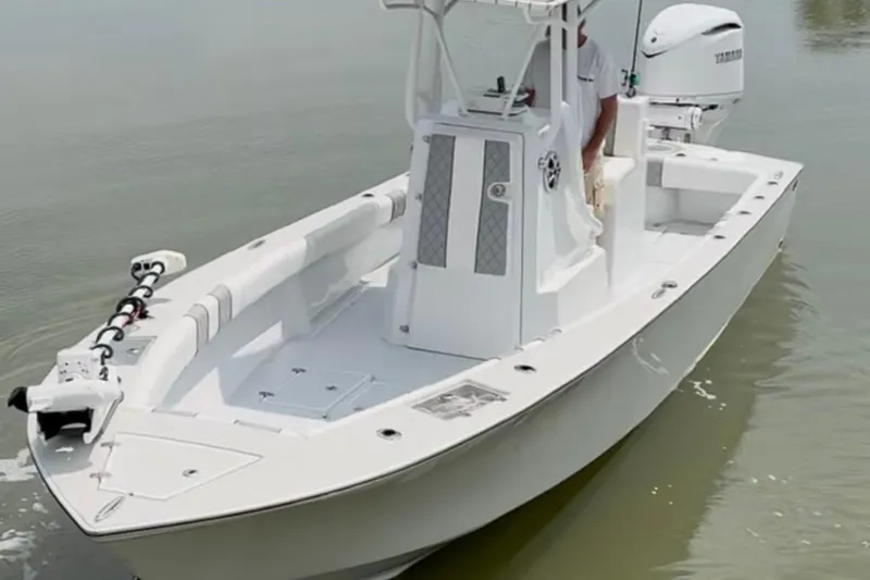 Slide: The Image of 2021 Latitude Tournament Boats 25 model on calm water, featuring sleek design and modern equipment. - 13