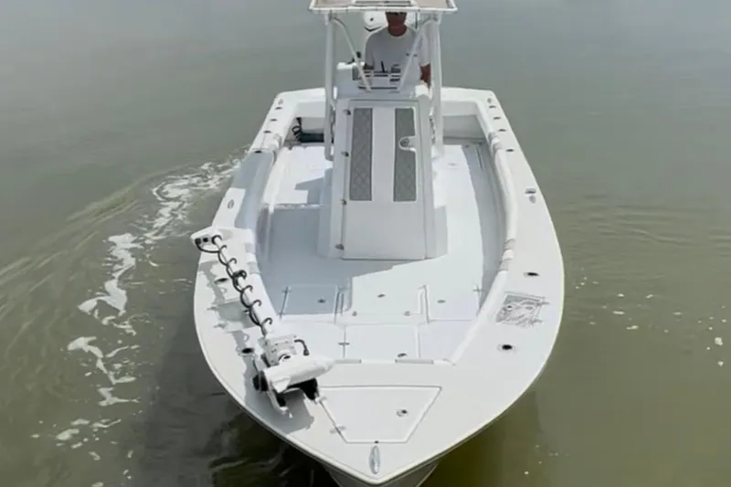 Slide: The Image of 2021 Latitude Tournament Boats 25 navigating calm waters. - 14