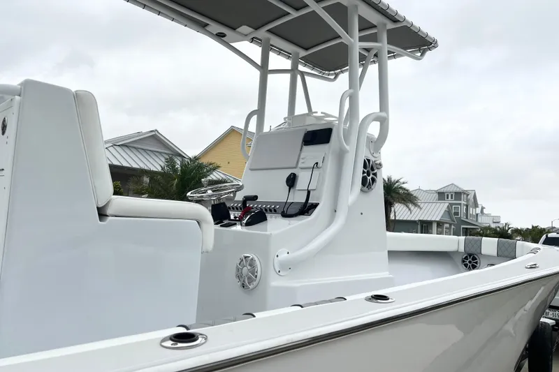 Slide: The Image of 2021 Latitude Tournament Boats 25, sleek design, modern console, residential backdrop. - 4