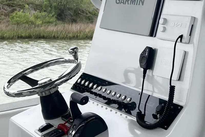 Slide: The Image of 2021 Latitude Tournament Boats 25 helm with Garmin navigation and Yamaha controls. - 7