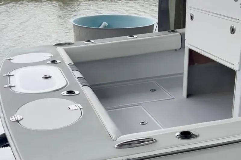Slide: The Image of 2021 Latitude Tournament Boats 25 interior, featuring sleek design and storage compartments. - 8