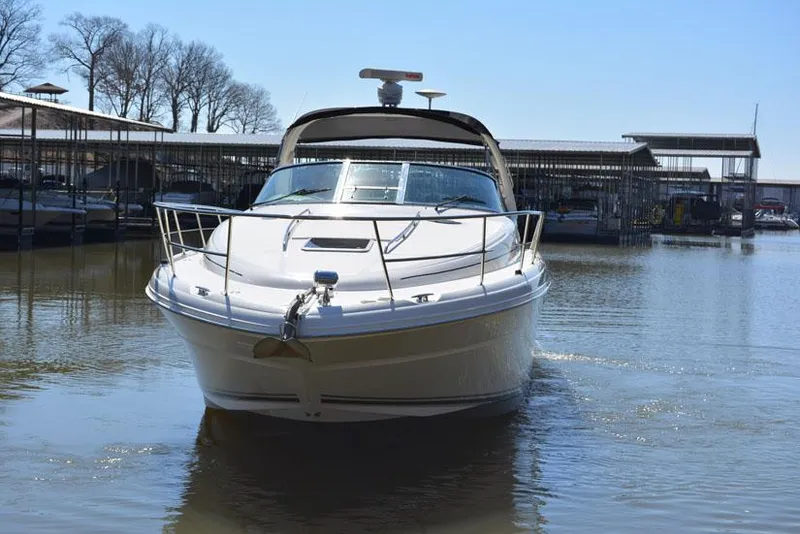 Slide: The Image of 2002 Sea Ray 360 Sundancer on water, front view. - 1