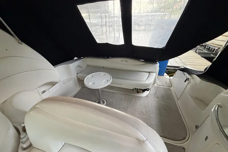 Slide: The Image of Interior of 2002 Sea Ray 360 Sundancer boat with seating and table. - 11