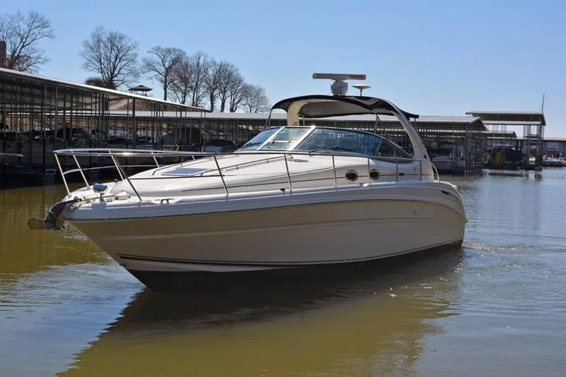 Slide: The Image of 2002 Sea Ray 360 Sundancer on calm water. - 2