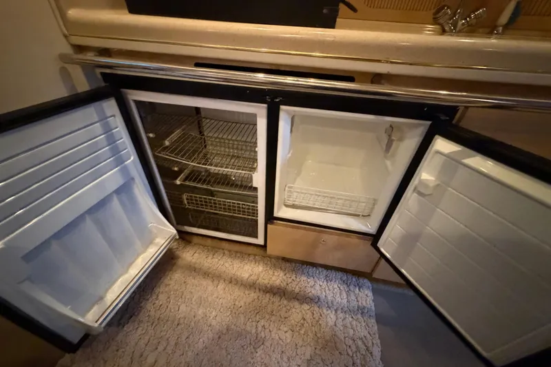 Slide: The Image of Open refrigerator and freezer in 2002 Sea Ray 360 Sundancer yacht kitchen. - 20