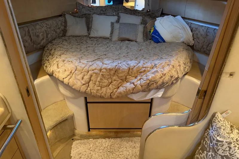 Slide: The Image of Luxurious cabin interior of a 2002 Sea Ray 360 Sundancer yacht with plush bedding. - 21