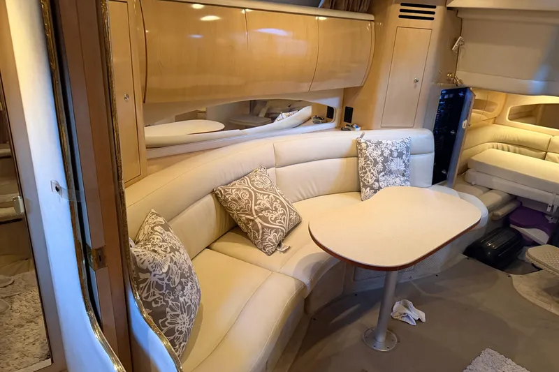 Slide: The Image of Interior of 2002 Sea Ray 360 Sundancer with elegant seating and decorative pillows. - 25