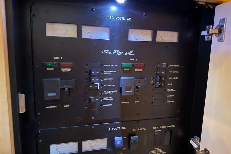 Slide: The Image of Electrical control panel of a 2002 Sea Ray 360 Sundancer boat. - 28