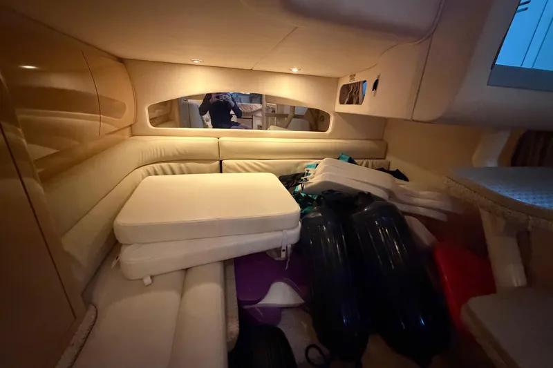 Slide: The Image of Interior cabin of 2002 Sea Ray 360 Sundancer with cushions and storage items. - 30